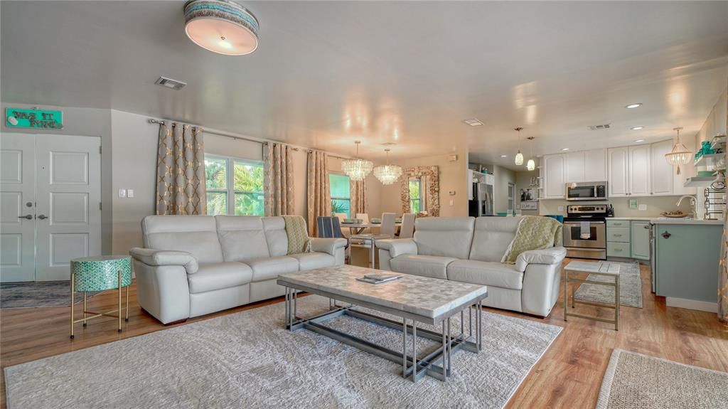 Dining room, Interior, Kitchen, Living room, Pendant Lights, Recessed Lighting, Stainless Steel Appliances, Wood Texture Flooring