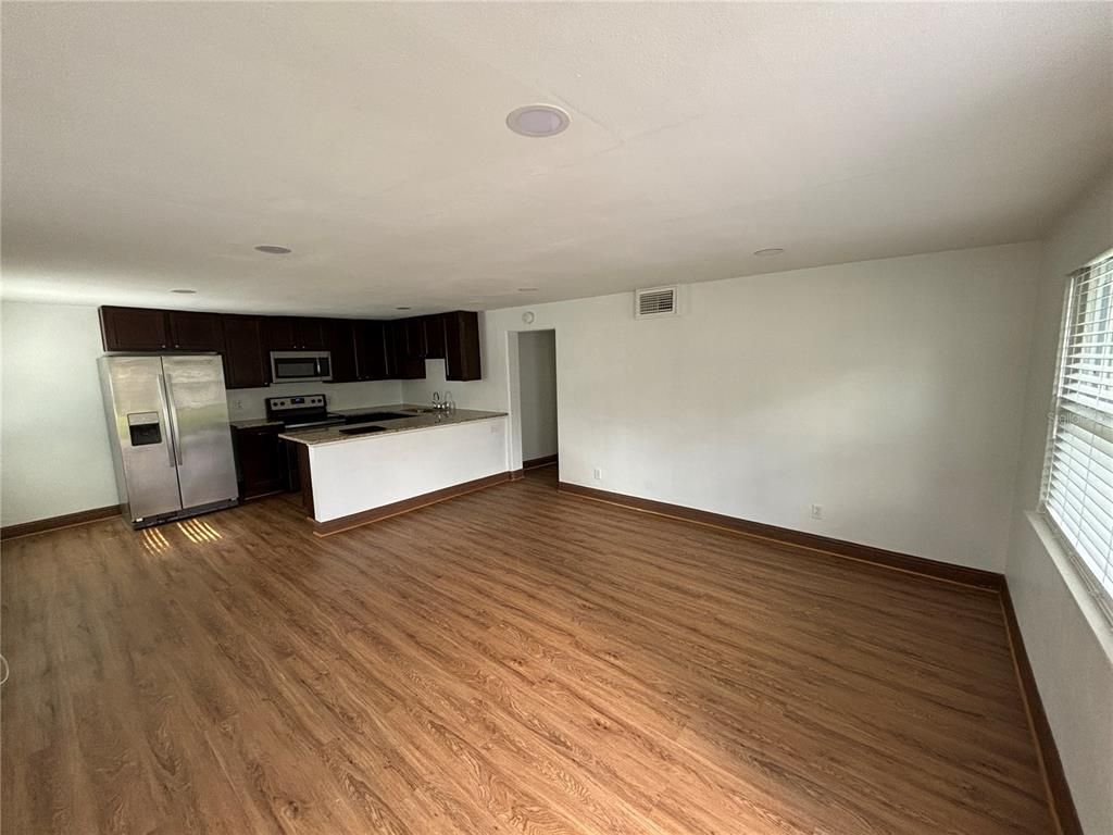 Empty room, Interior, Kitchen, Stainless Steel Appliances, Wood Texture Flooring