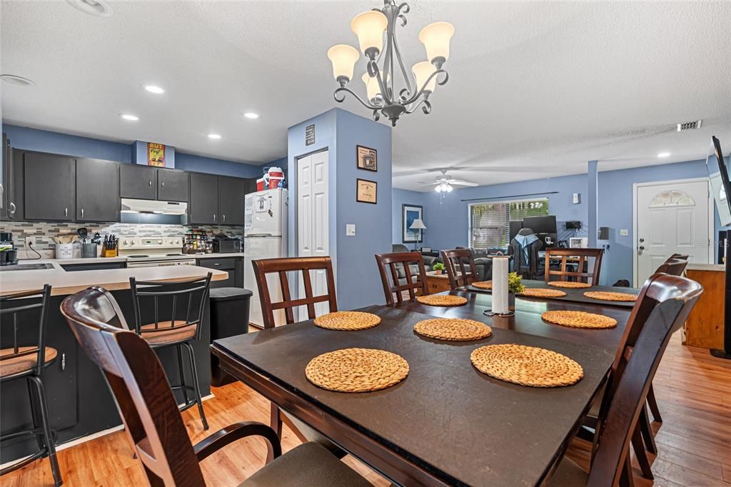Chandelier, Dining room, Interior, Kitchen, Recessed Lighting, Stainless Steel Appliances, Wood Texture Flooring