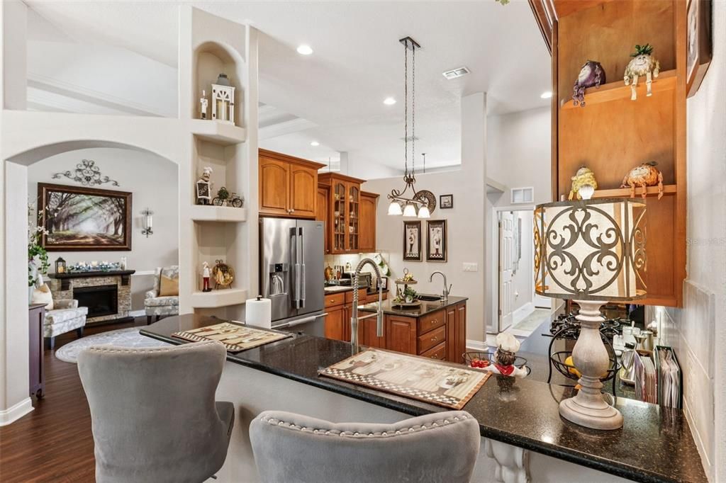 Fireplace, Interior, Kitchen, Living room, Pendant Lights, Recessed Lighting, Stainless Steel Appliances, Wood Texture Flooring