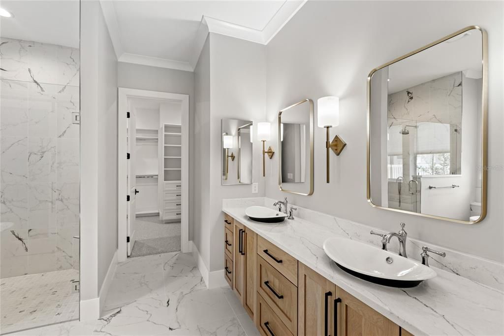 Bathroom, Dual Sink Vanities, Glass Shower, Interior, Marble, Marble Walls, Recessed Lighting, Walk-in Closets