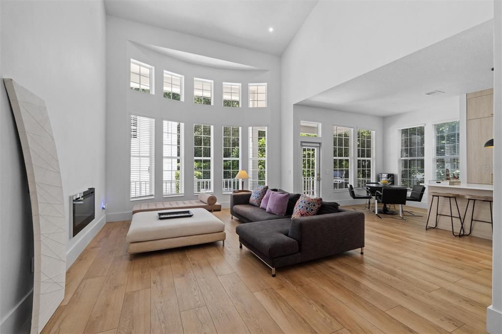 Dining room, Fireplace, Interior, Living room, Recessed Lighting, Wood Texture Flooring