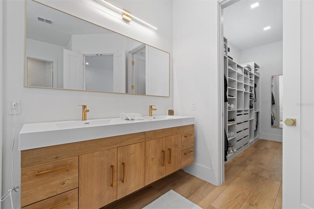 Bathroom, Dual Sink Vanities, Interior, Recessed Lighting, Walk-in Closets, Wood Texture Flooring