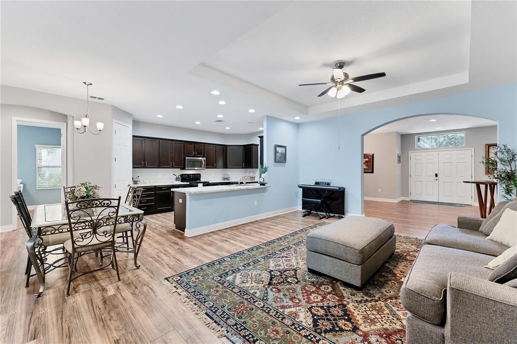 Chandelier, Dining room, Interior, Kitchen, Living room, Pendant Lights, Recessed Lighting, Stainless Steel Appliances, Wood Texture Flooring