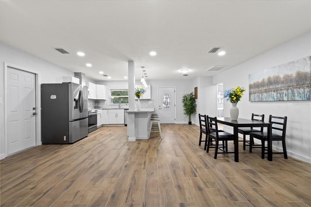 Dining room, Interior, Kitchen, Pendant Lights, Recessed Lighting, Stainless Steel Appliances, Wood Texture Flooring