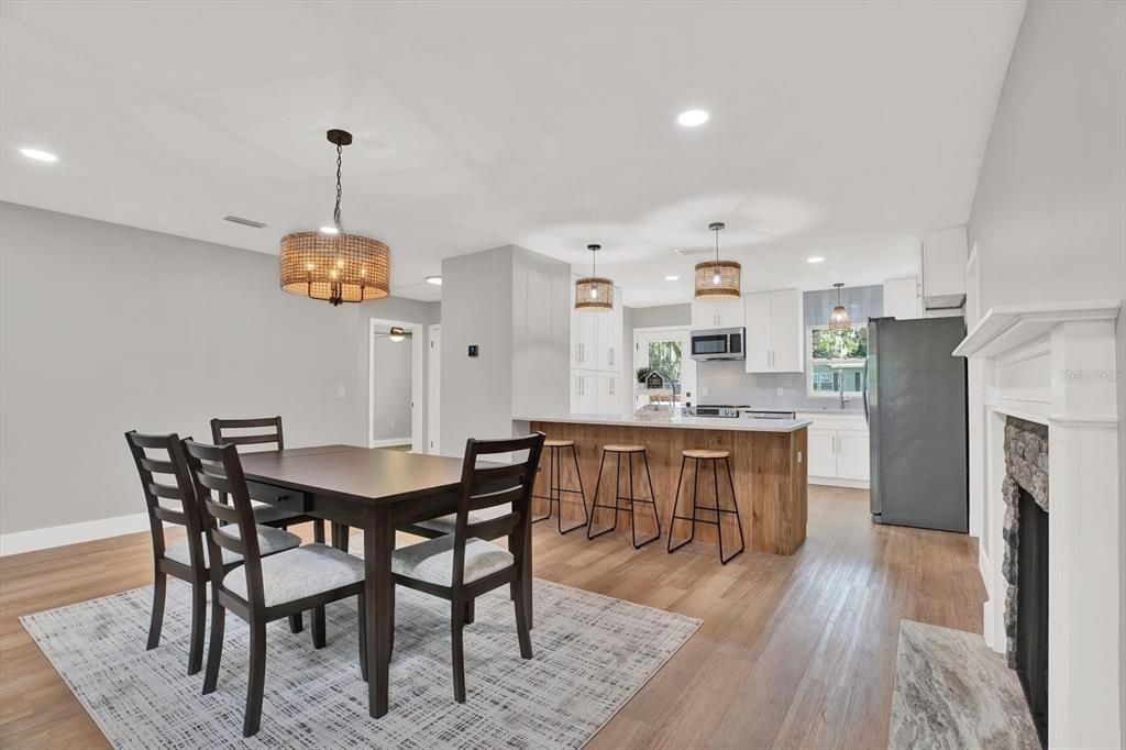 Dining room, Fireplace, Interior, Kitchen, Pendant Lights, Recessed Lighting, Wood Texture Flooring