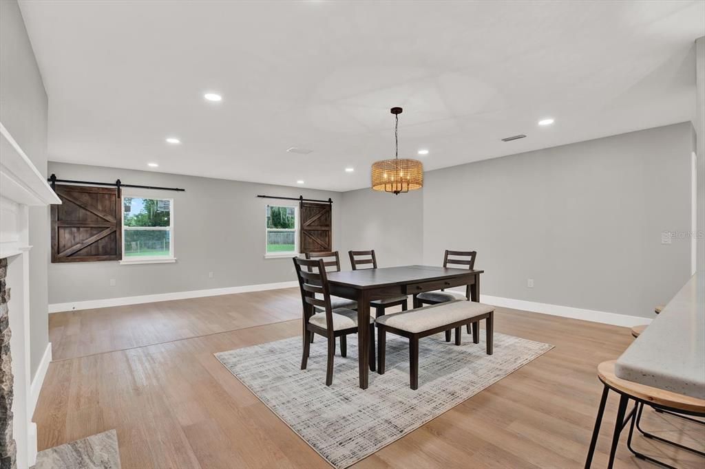 Dining room, Fireplace, Interior, Pendant Lights, Recessed Lighting, Wood Texture Flooring
