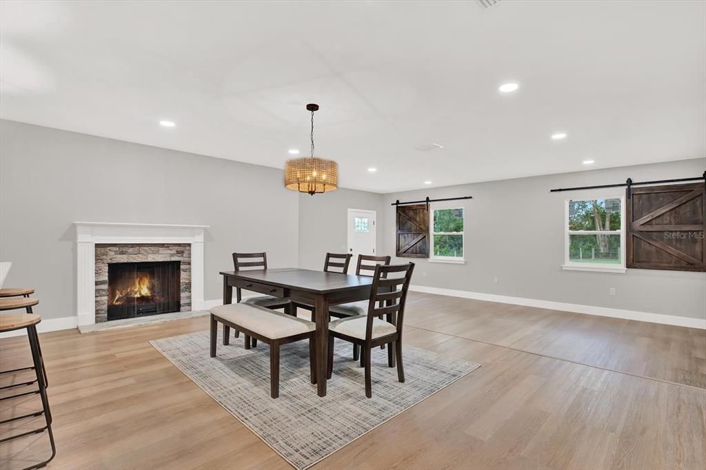 Dining room, Fireplace, Interior, Pendant Lights, Recessed Lighting, Wood Texture Flooring