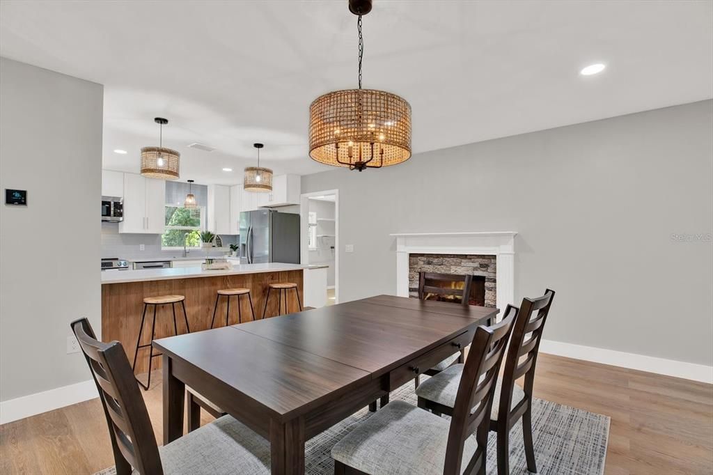 Chandelier, Dining room, Fireplace, Interior, Kitchen, Pendant Lights, Recessed Lighting, Wood Texture Flooring