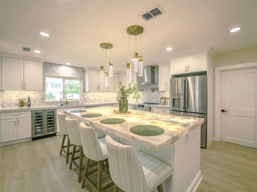 Interior, Kitchen, Marble Walls, Pendant Lights, Recessed Lighting, Stainless Steel Appliances, Wood Texture Flooring