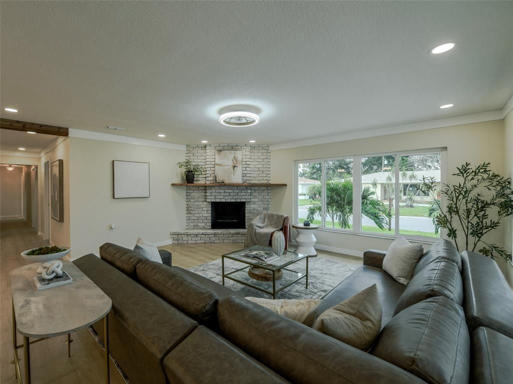 Fireplace, Interior, Living room, Recessed Lighting, Stone Walls, Wood Texture Flooring