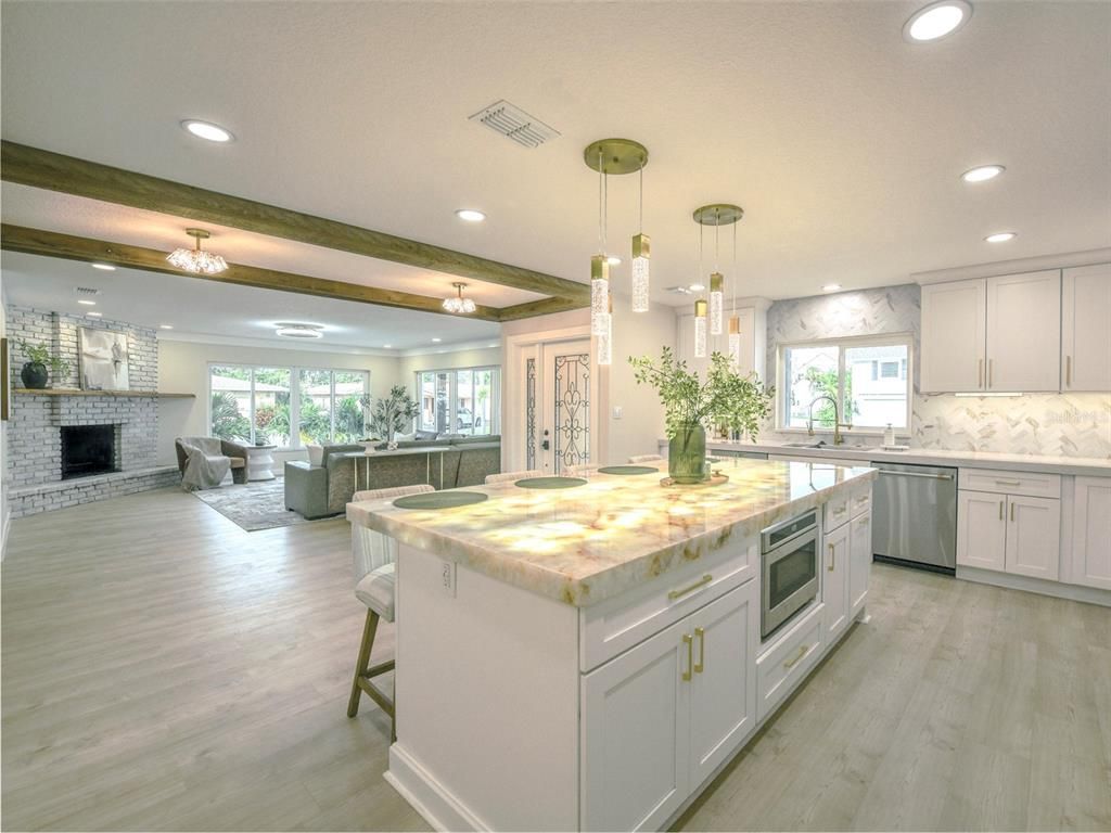 Fireplace, Interior, Kitchen, Living room, Pendant Lights, Recessed Lighting, Stainless Steel Appliances, Wood Texture Flooring