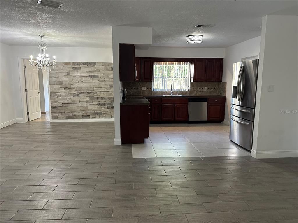 Chandelier, Interior, Kitchen, Stainless Steel Appliances, Stone Walls, Wood Texture Flooring