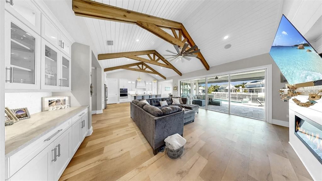 Fireplace, Interior, Living room, Pendant Lights, Recessed Lighting, Wooden Beams, Wood Texture Flooring