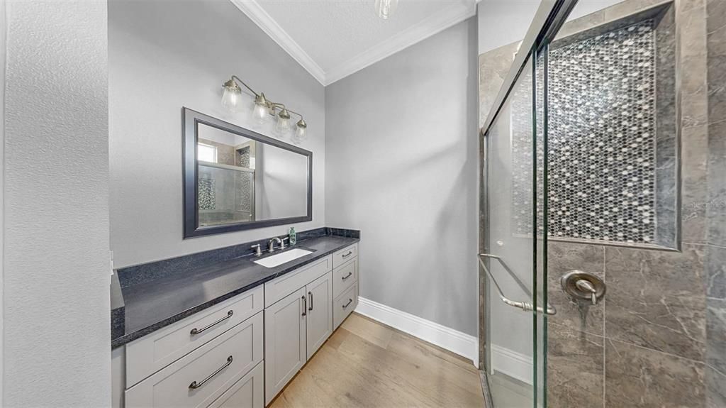 Bathroom, Dual Sink Vanities, Glass Shower, Interior, Wood Texture Flooring