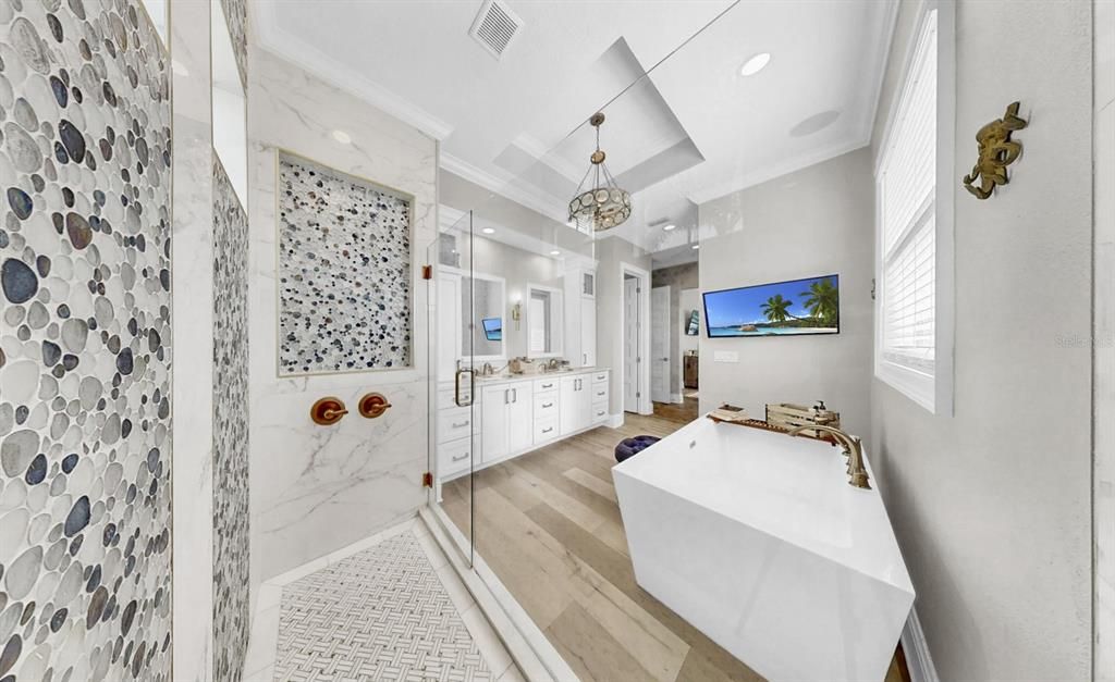 Bathroom, Free Standing Baths, Interior, Marble Walls, Pendant Lights, Recessed Lighting, Wood Texture Flooring