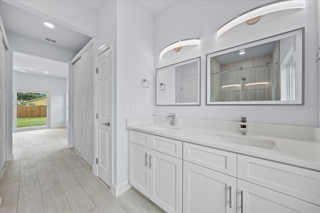 Bathroom, Dual Sink Vanities, Interior, Recessed Lighting, Wood Texture Flooring