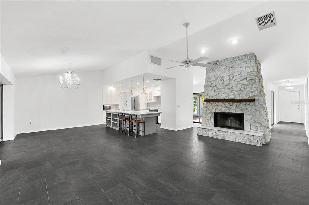 Chandelier, Empty room, Fireplace, Interior, Kitchen, Pendant Lights, Recessed Lighting, Stone Walls, Wood Texture Flooring