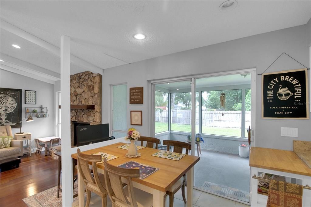 Dining room, Fireplace, Interior, Recessed Lighting, Stone Walls, Wood Texture Flooring