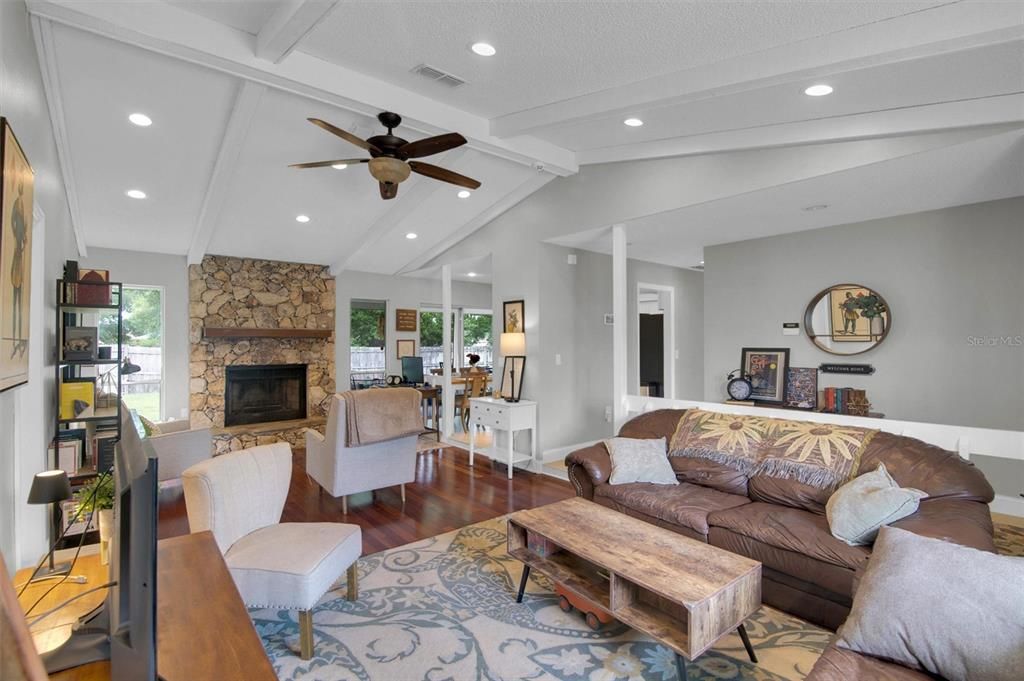 Fireplace, Interior, Living room, Recessed Lighting, Stone Walls, Wood Texture Flooring