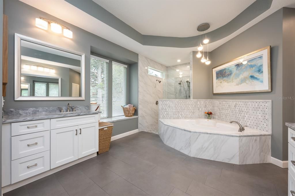 Bathroom, Dual Sink Vanities, Glass Shower, Interior, Marble Walls, Pendant Lights, Recessed Lighting