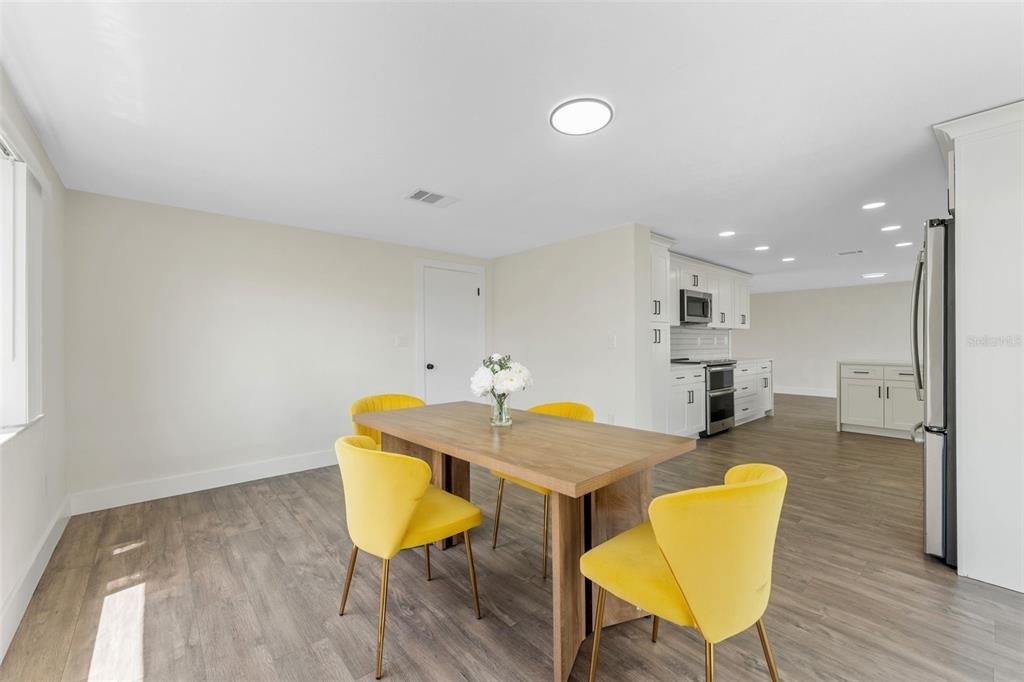 Dining room, Interior, Kitchen, Recessed Lighting, Stainless Steel Appliances, Wood Texture Flooring