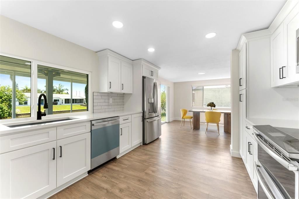 Dining room, Interior, Kitchen, Recessed Lighting, Stainless Steel Appliances, Wood Texture Flooring