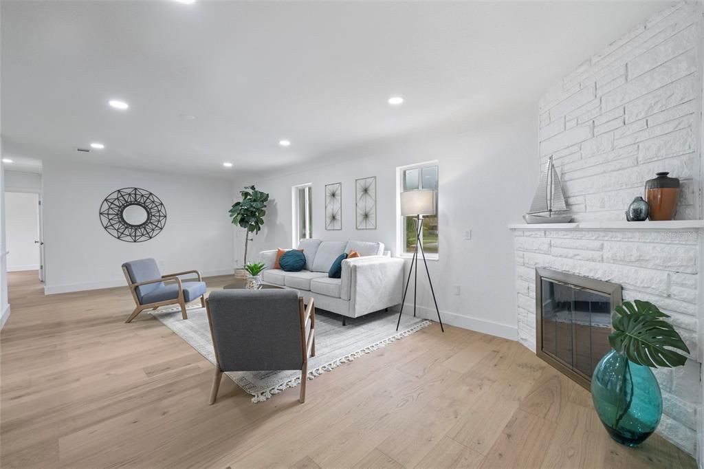 Fireplace, Interior, Living room, Recessed Lighting, Stone Walls, Wood Texture Flooring