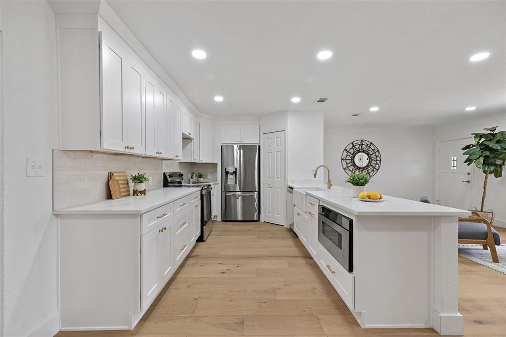 Interior, Kitchen, Recessed Lighting, Stainless Steel Appliances, Wood Texture Flooring