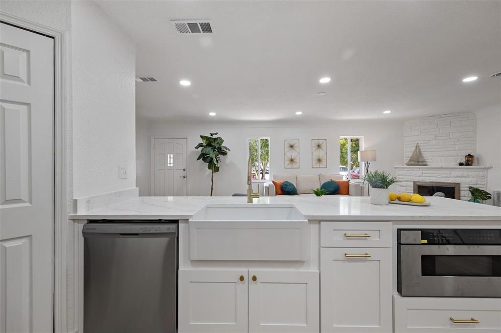 Fireplace, Interior, Kitchen, Recessed Lighting, Stainless Steel Appliances, Stone Walls