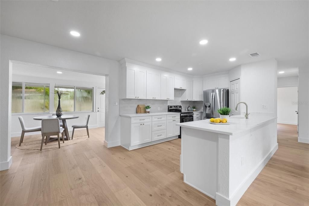 Dining room, Interior, Kitchen, Recessed Lighting, Stainless Steel Appliances, Wood Texture Flooring