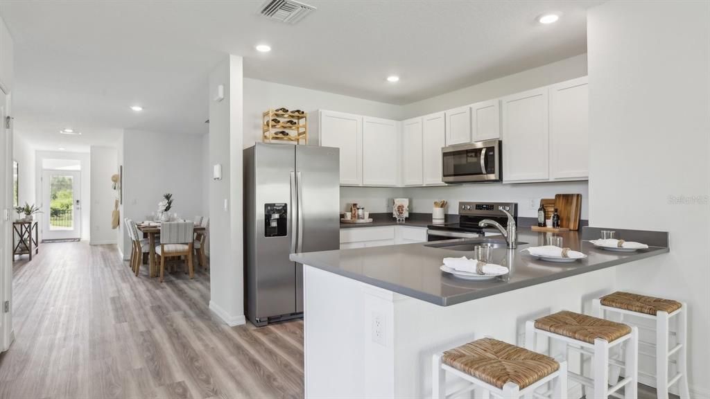 Dining room, Interior, Kitchen, Recessed Lighting, Stainless Steel Appliances, Wood Texture Flooring