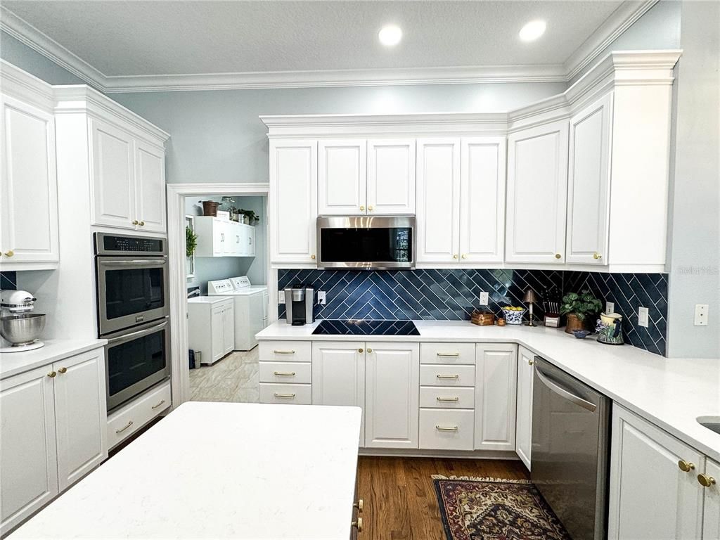 Interior, Kitchen, Recessed Lighting, Tile Countertops, Wood Texture Flooring