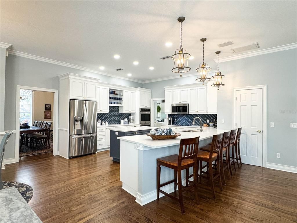 Dining room, Interior, Kitchen, Pendant Lights, Recessed Lighting, Stainless Steel Appliances, Wood Texture Flooring