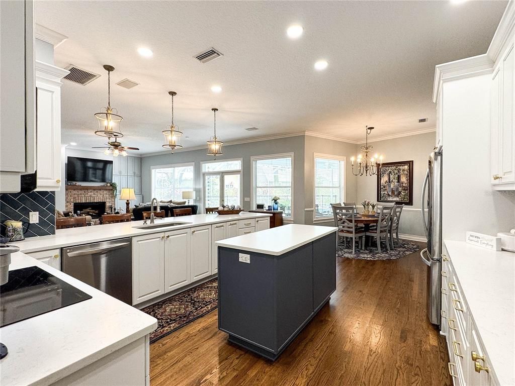Chandelier, Dining room, Fireplace, Interior, Kitchen, Pendant Lights, Recessed Lighting, Wood Texture Flooring