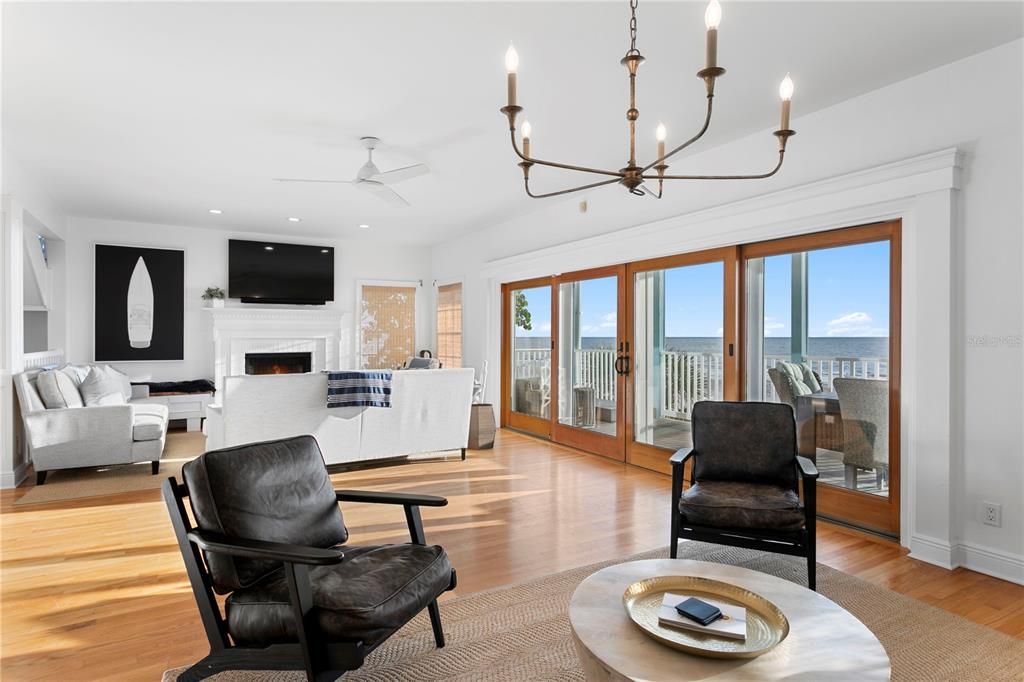 Chandelier, Fireplace, Interior, Living room, Recessed Lighting, Water, Wood Texture Flooring