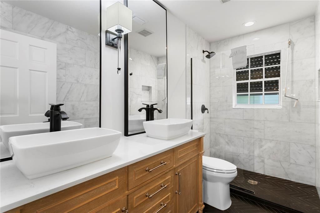 Bathroom, Dual Sink Vanities, Glass Shower, Interior, Marble Walls, Recessed Lighting