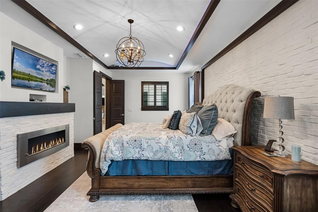 Bedroom, Chandelier, Fireplace, Interior, Recessed Lighting, Wood Texture Flooring