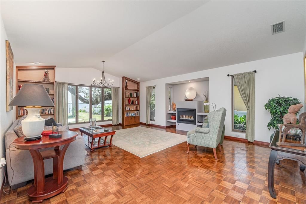 Chandelier, Fireplace, Interior, Living room, Recessed Lighting, Wood Texture Flooring