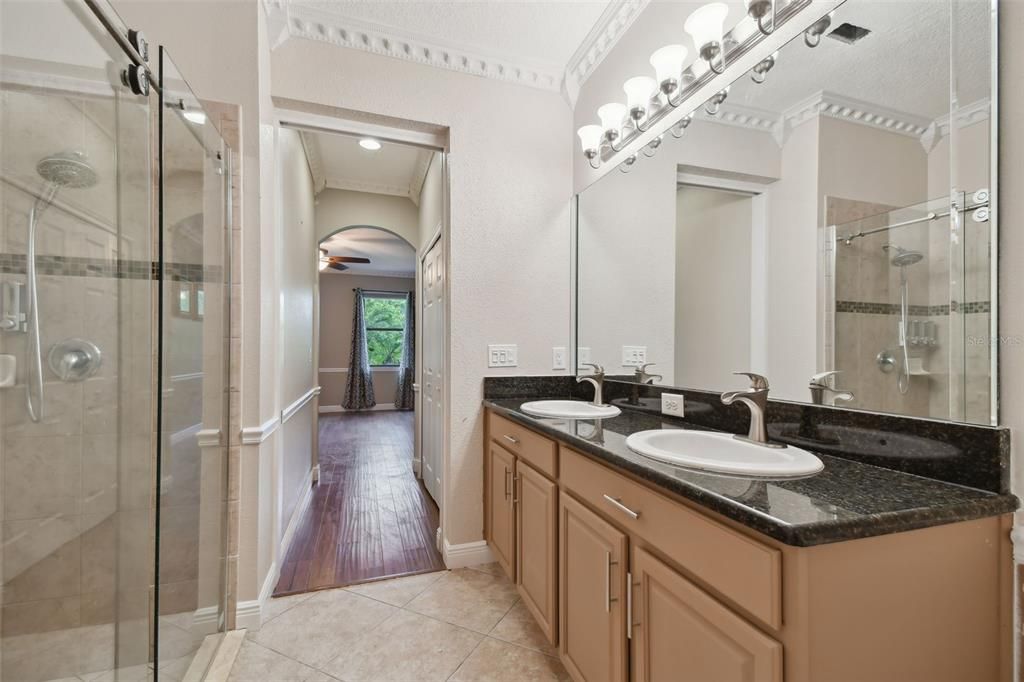 Bathroom, Dual Sink Vanities, Glass Shower, Interior, Recessed Lighting, Wood Texture Flooring