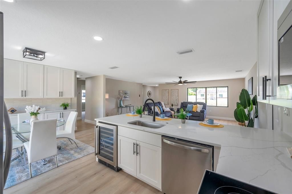 Dining room, Interior, Kitchen, Living room, Recessed Lighting, Stainless Steel Appliances, Wood Texture Flooring