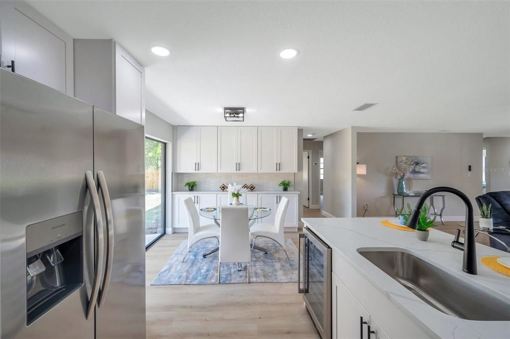 Dining room, Interior, Kitchen, Recessed Lighting, Stainless Steel Appliances, Wood Texture Flooring