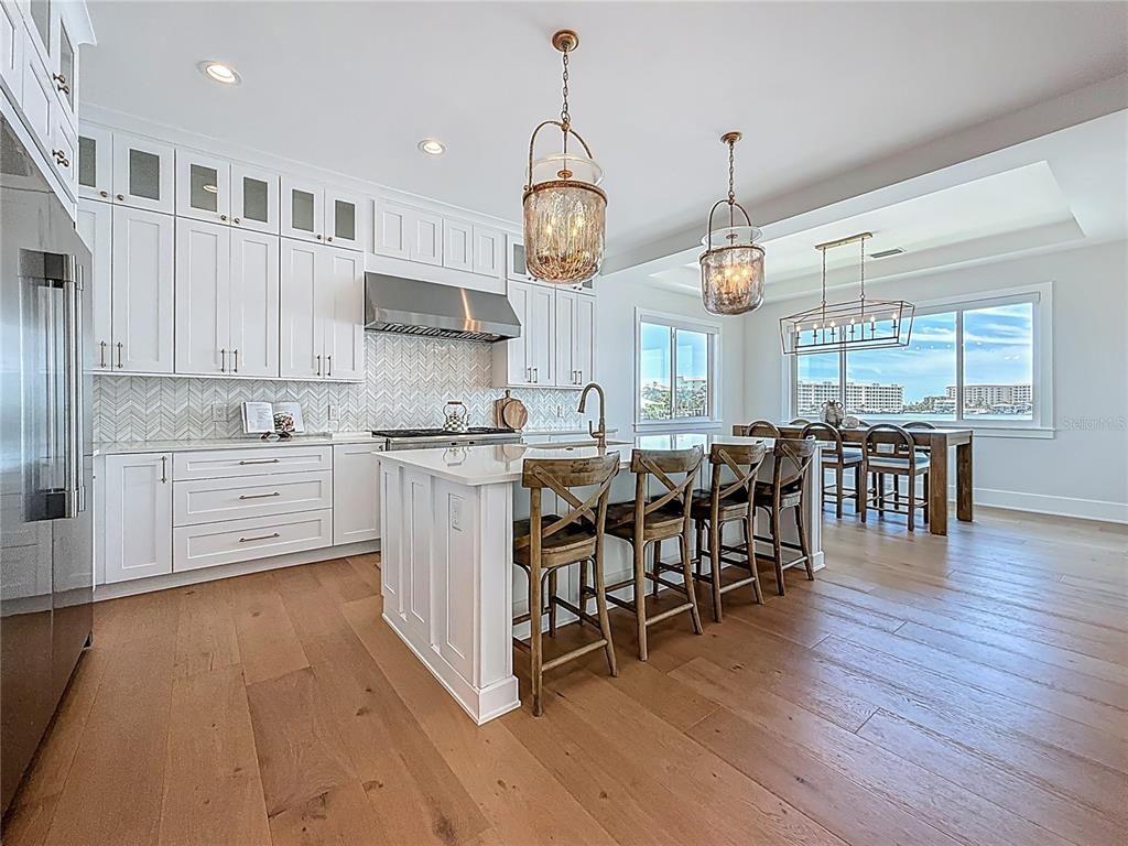 Dining room, Interior, Kitchen, Pendant Lights, Recessed Lighting, Stainless Steel Appliances, Wood Texture Flooring