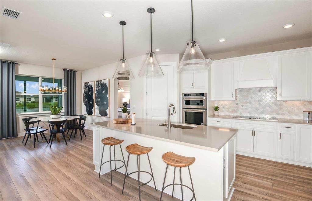 Dining room, Interior, Kitchen, Pendant Lights, Recessed Lighting, Stainless Steel Appliances, Wood Texture Flooring