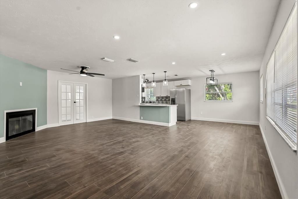Empty room, Fireplace, Interior, Pendant Lights, Recessed Lighting, Wood Texture Flooring