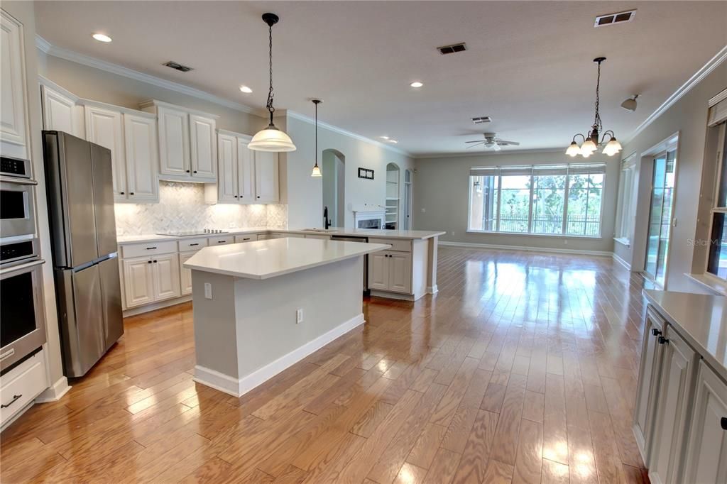 Chandelier, Interior, Kitchen, Pendant Lights, Recessed Lighting, Stainless Steel Appliances, Wood Texture Flooring