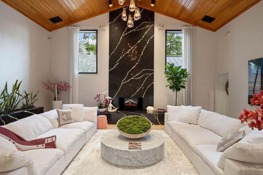 Chandelier, Fireplace, Interior, Living room, Marble Walls, Wooden Ceilings