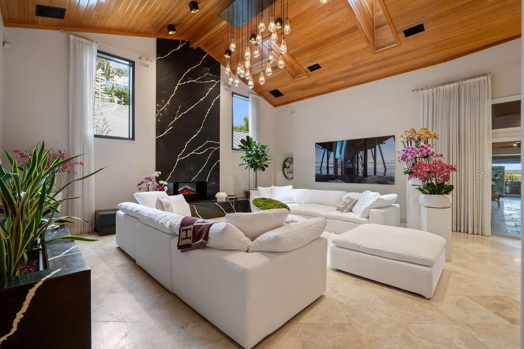 Fireplace, Interior, Living room, Marble Walls, Pendant Lights, Recessed Lighting, Wooden Ceilings