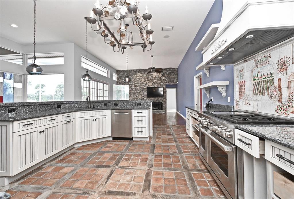 Fireplace, Interior, Kitchen, Pendant Lights, Recessed Lighting, Stainless Steel Appliances, Stone Walls