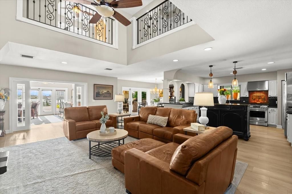 Chandelier, Dining room, Interior, Kitchen, Living room, Pendant Lights, Recessed Lighting, Stainless Steel Appliances, Wood Texture Flooring